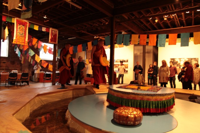 MonksCrossingBridgeToMandalaPlatform